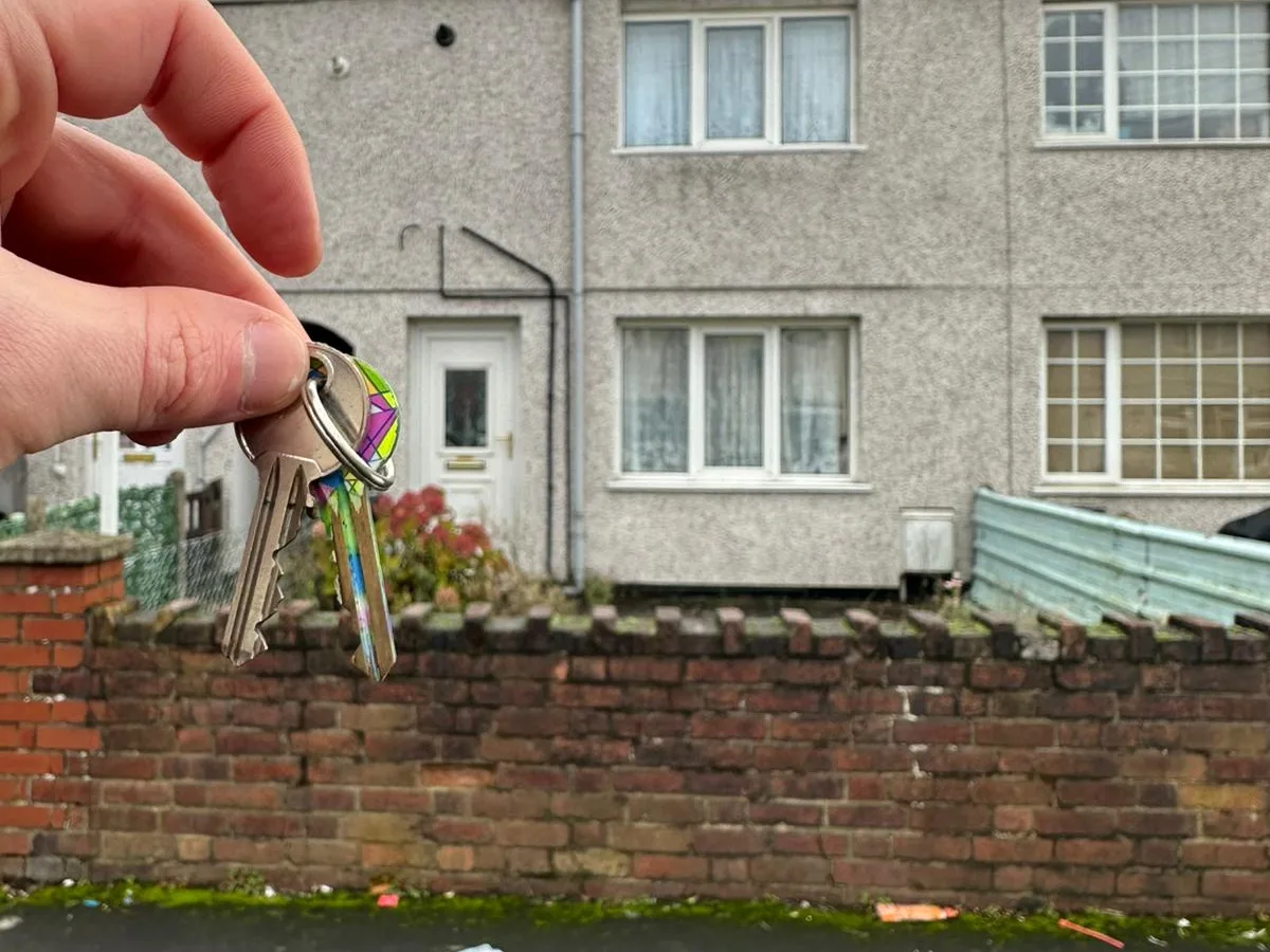 Keys held up in front of a house on The Crescent.